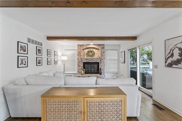 2405 W 124th St, Leawood, KS 66209 - living room featuring beam ceiling, wood finished floors, and a fireplace
