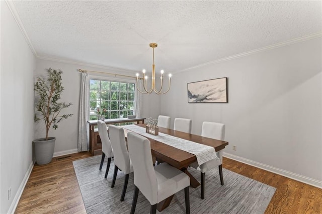 2405 W 124th St, Leawood, KS 66209 - dining area with a chandelier, a textured ceiling, crown molding, and wood finished floors