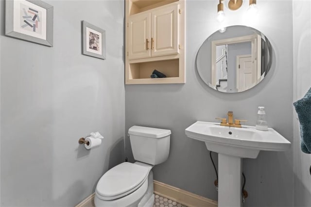 2405 W 124th St, Leawood, KS 66209 - half bathroom featuring toilet and tile patterned floors