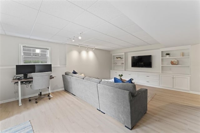 2405 W 124th St, Leawood, KS 66209 - living area with rail lighting, light wood finished floors, an office area, and built in shelves