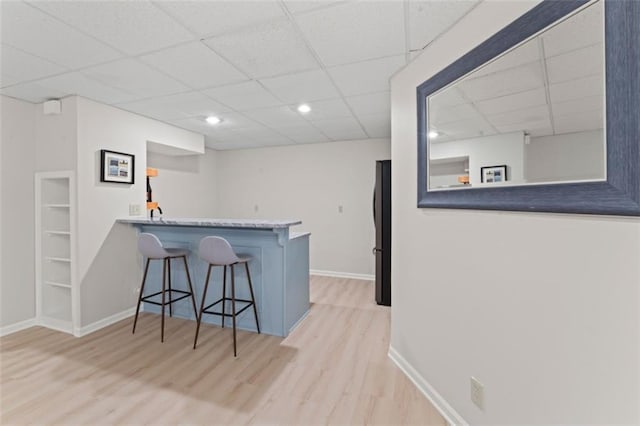 2405 W 124th St, Leawood, KS 66209 - indoor bar with a paneled ceiling, freestanding refrigerator, and wood finished floors