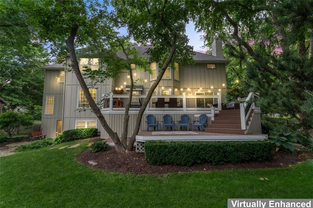 2405 W 124th St, Leawood, KS 66209 - back of house with stairs, a yard, board and batten siding, a chimney, and a deck