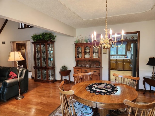 16904 E 36th St S, Independence, MO 64055 - dining room with a chandelier and light wood-type flooring
