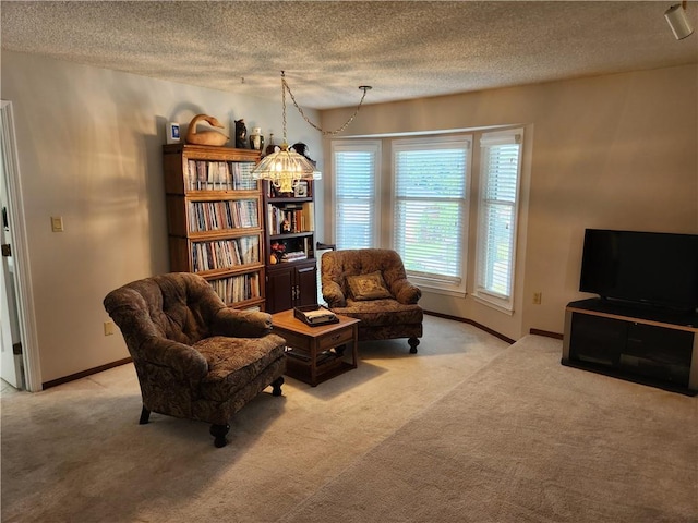 16904 E 36th St S, Independence, MO 64055 - living area featuring a textured ceiling, light colored carpet, and a chandelier