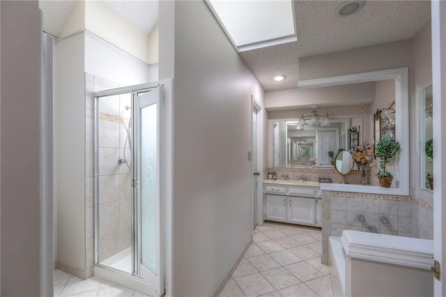 16904 E 36th St S, Independence, MO 64055 - full bath featuring vanity, a stall shower, a garden tub, tile patterned flooring, and recessed lighting