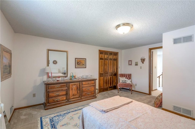 16904 E 36th St S, Independence, MO 64055 - bedroom with light carpet, a closet, and a textured ceiling