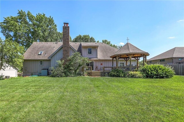 16904 E 36th St S, Independence, MO 64055 - back of house with a gazebo, a yard, and a chimney