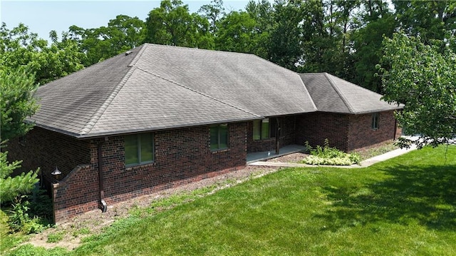 3111 N 35th St, Saint Joseph, MO 64506 - ranch-style house featuring a front lawn, brick siding, and a shingled roof