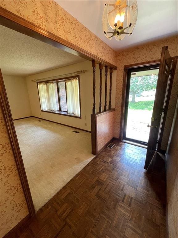 3111 N 35th St, Saint Joseph, MO 64506 - entryway featuring a chandelier and baseboards