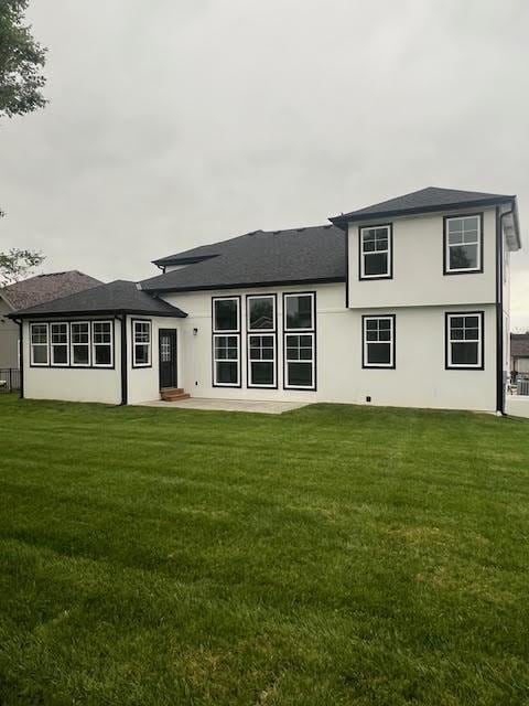 26433 W 144th Ter, Olathe, KS 66061 - rear view of house with a yard and stucco siding