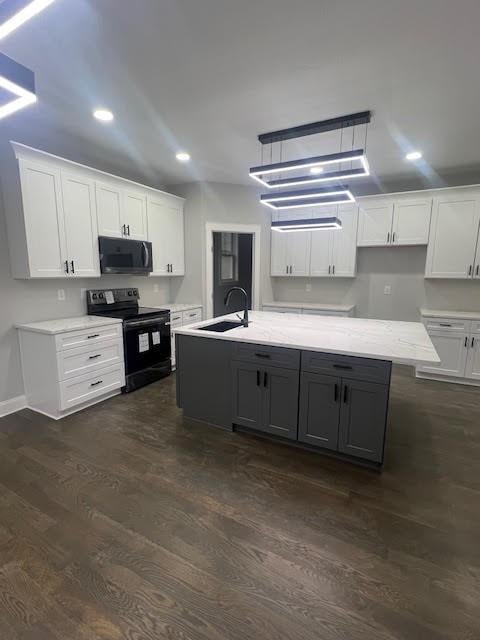 26433 W 144th Ter, Olathe, KS 66061 - kitchen with black appliances, white cabinetry, dark wood-style flooring, and recessed lighting