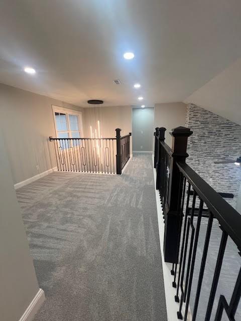 26433 W 144th Ter, Olathe, KS 66061 - corridor with an upstairs landing, recessed lighting, and light carpet