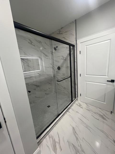 26433 W 144th Ter, Olathe, KS 66061 - bathroom featuring marble finish flooring and a marble finish shower