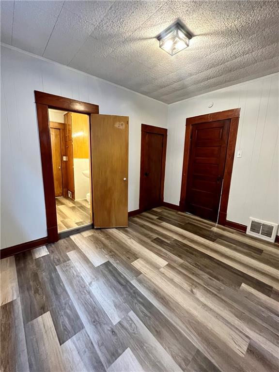2830 Jules St, Saint Joseph, MO 64501 - empty room featuring wood finished floors and baseboards