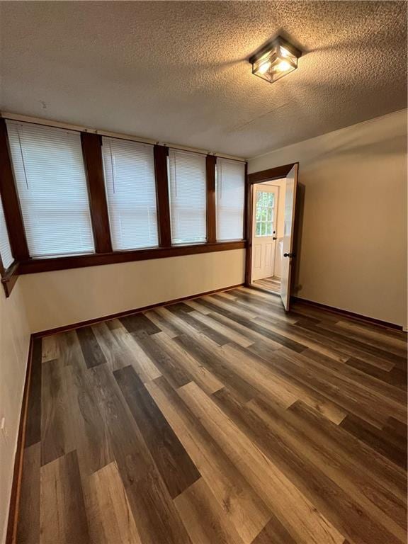 2830 Jules St, Saint Joseph, MO 64501 - unfurnished room with wood finished floors and a textured ceiling