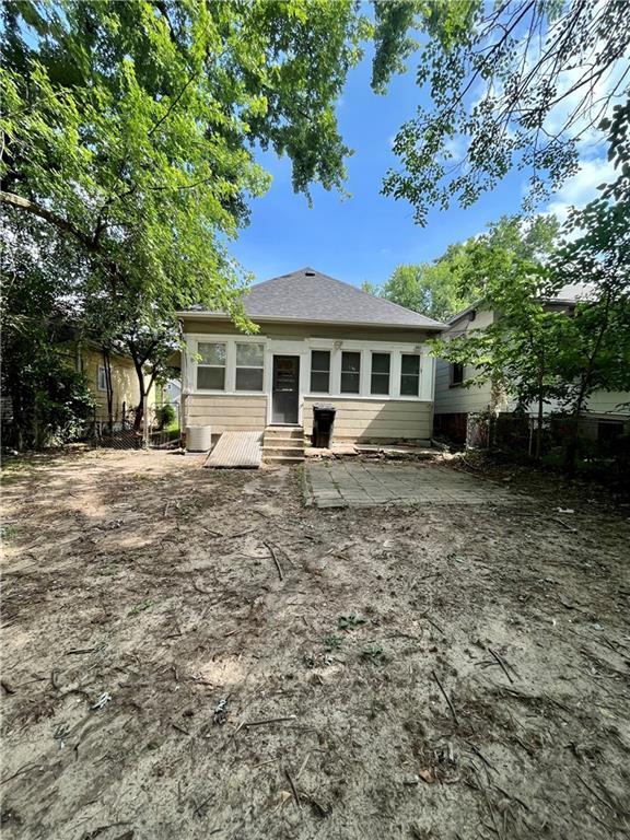 2830 Jules St, Saint Joseph, MO 64501 - rear view of property with entry steps and roof with shingles