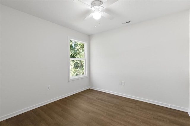 719 E Culton St, Warrensburg, MO 64093 - empty room with dark wood-style flooring and a ceiling fan