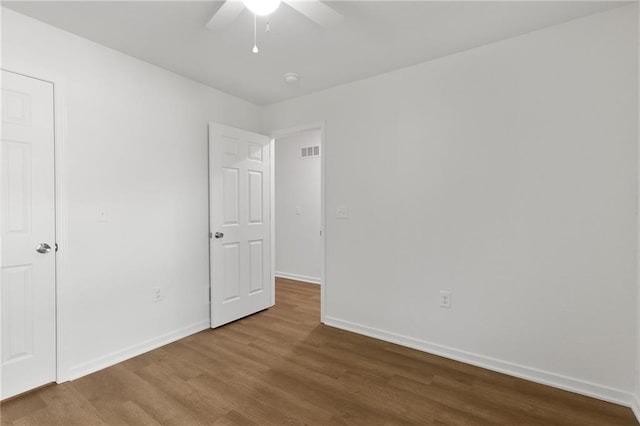 719 E Culton St, Warrensburg, MO 64093 - unfurnished bedroom featuring wood finished floors and ceiling fan