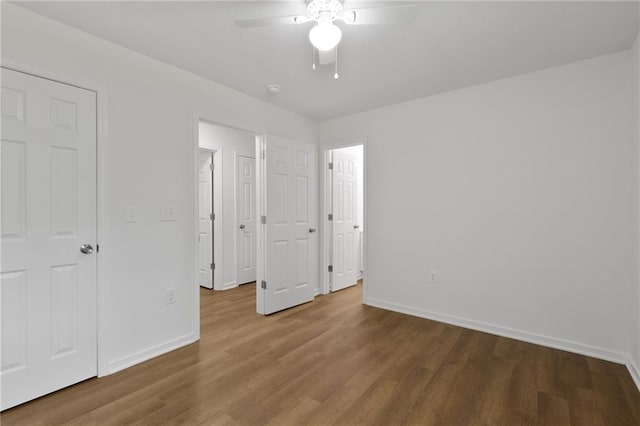 719 E Culton St, Warrensburg, MO 64093 - unfurnished bedroom with wood finished floors and a ceiling fan