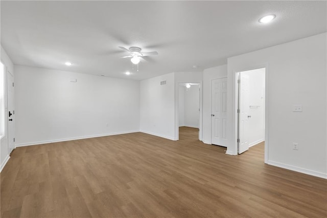 719 E Culton St, Warrensburg, MO 64093 - spare room with a ceiling fan, wood finished floors, and recessed lighting