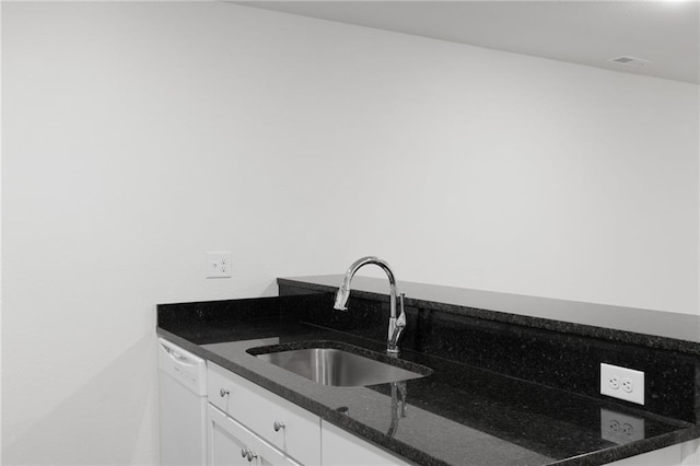 719 E Culton St, Warrensburg, MO 64093 - kitchen with dishwasher, white cabinets, and dark stone counters