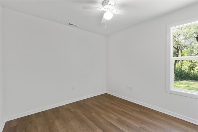 719 E Culton St, Warrensburg, MO 64093 - empty room featuring dark wood-type flooring and a ceiling fan