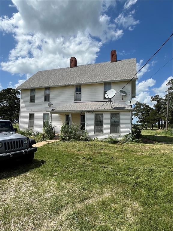627 50th Rd, Toronto, KS 66777 - view of front of home featuring a front lawn and a chimney