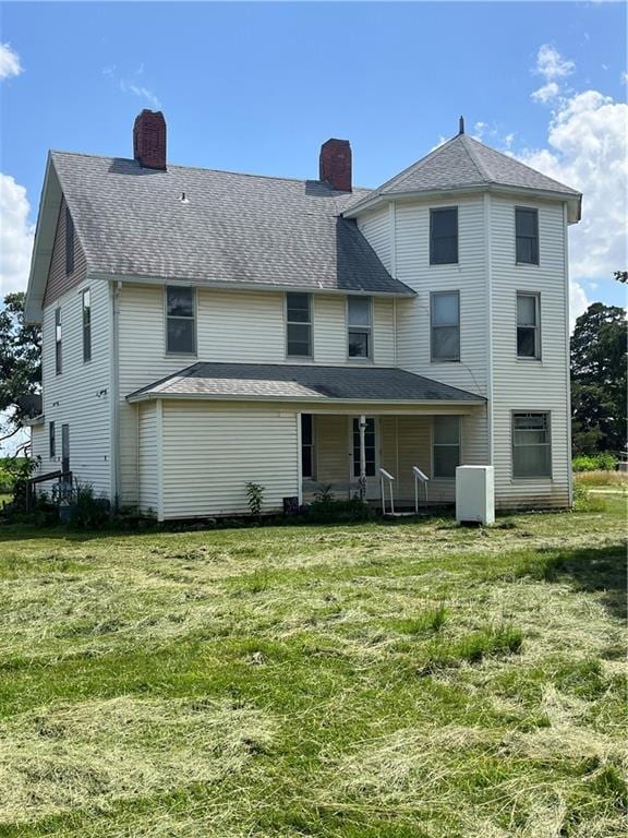 627 50th Rd, Toronto, KS 66777 - back of house featuring a chimney, a lawn, and a porch
