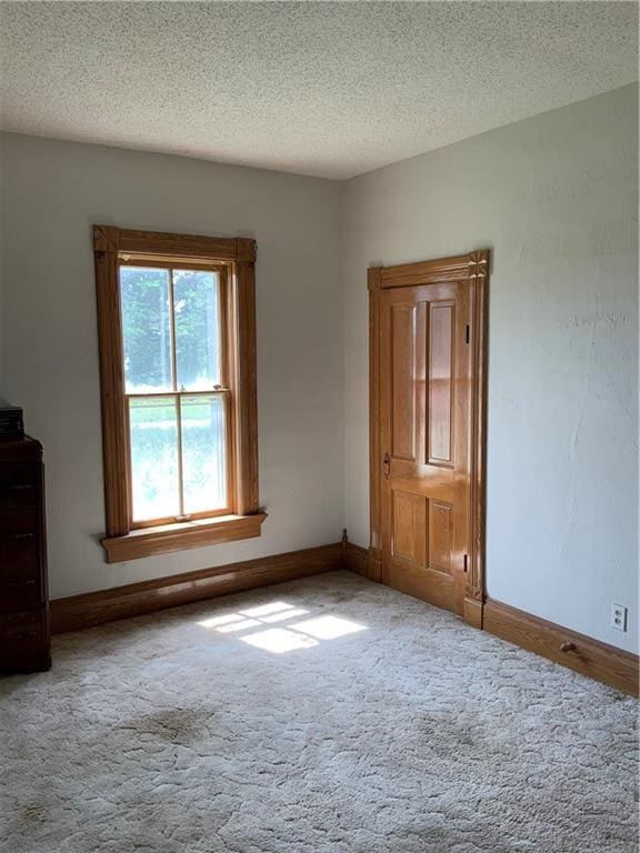 627 50th Rd, Toronto, KS 66777 - carpeted spare room featuring a textured ceiling and baseboards
