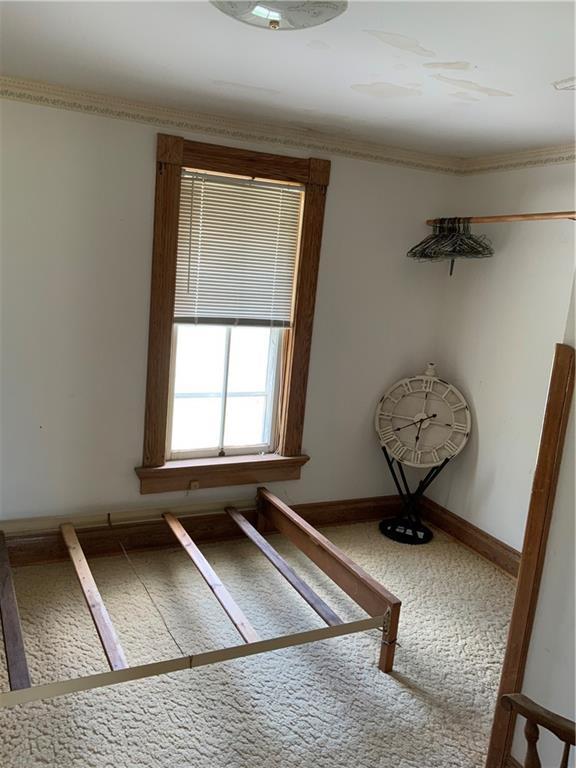 627 50th Rd, Toronto, KS 66777 - unfurnished bedroom with carpet flooring and crown molding