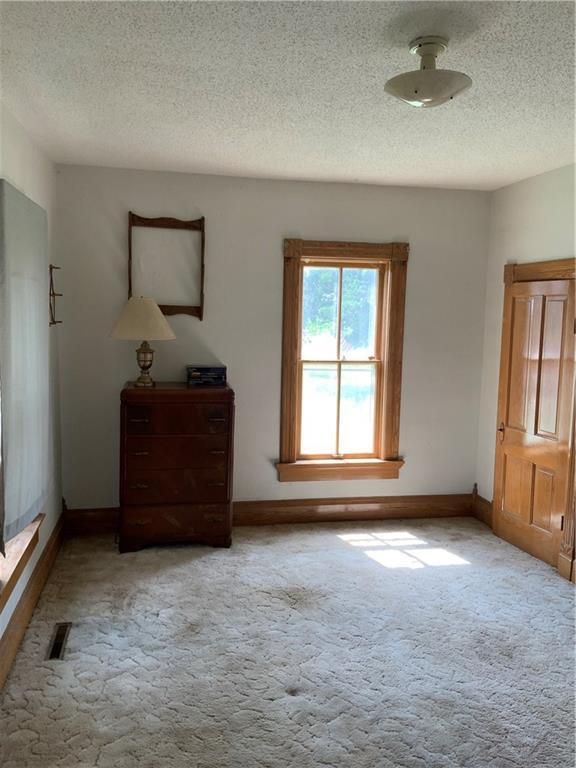 627 50th Rd, Toronto, KS 66777 - unfurnished bedroom with carpet flooring and a textured ceiling