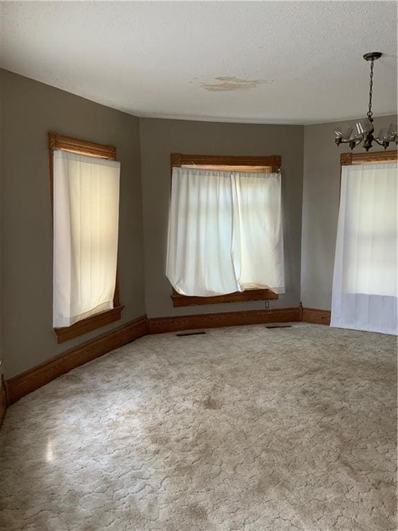 627 50th Rd, Toronto, KS 66777 - unfurnished room with a chandelier and carpet flooring