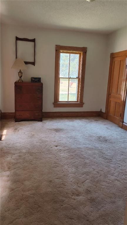 627 50th Rd, Toronto, KS 66777 - carpeted spare room featuring baseboards and a textured ceiling