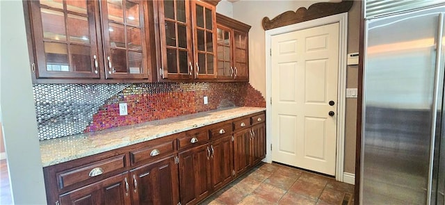 789 Maple Rd, Uniontown, KS 66779 - bar with built in fridge and tasteful backsplash