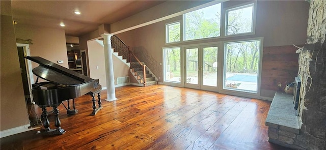 789 Maple Rd, Uniontown, KS 66779 - living area featuring wood-type flooring, french doors, stairs, recessed lighting, and decorative columns