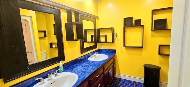789 Maple Rd, Uniontown, KS 66779 - full bath featuring double vanity and tile patterned flooring