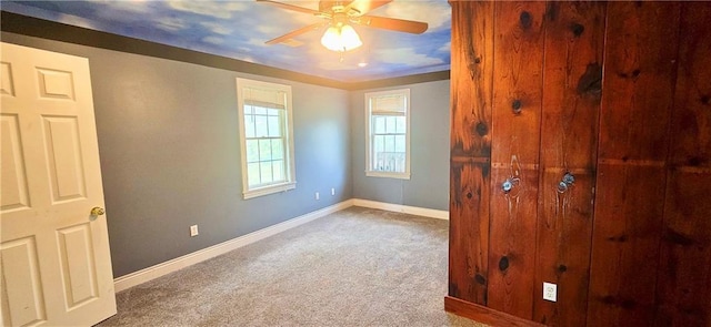 789 Maple Rd, Uniontown, KS 66779 - unfurnished room with carpet flooring and a ceiling fan