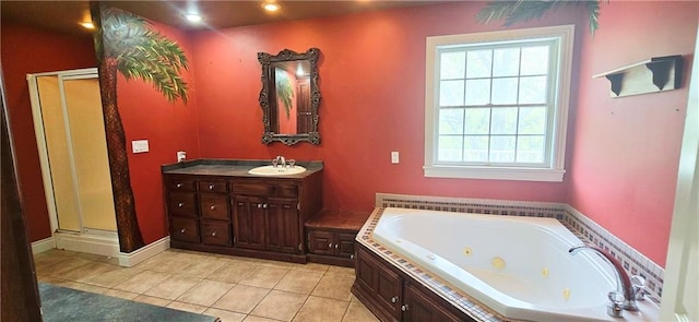 789 Maple Rd, Uniontown, KS 66779 - bathroom with a shower stall, a jetted tub, tile patterned flooring, and vanity