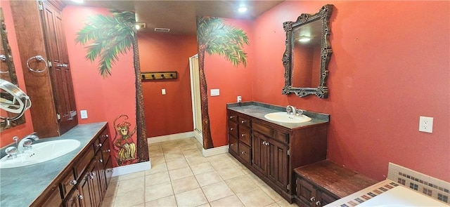 789 Maple Rd, Uniontown, KS 66779 - bathroom featuring tile patterned floors, two vanities, a shower stall, and a tub to relax in