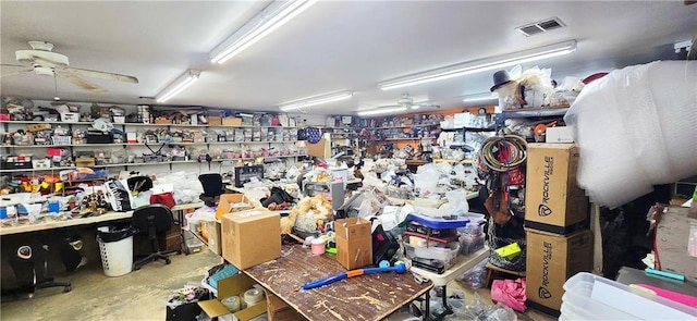 789 Maple Rd, Uniontown, KS 66779 - misc room with ceiling fan, a workshop area, and concrete floors