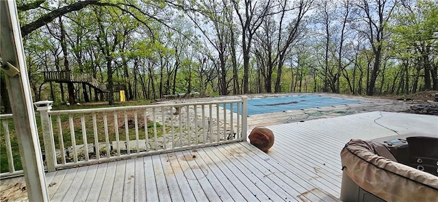 789 Maple Rd, Uniontown, KS 66779 - wooden deck with a covered pool