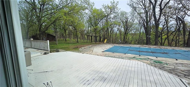 789 Maple Rd, Uniontown, KS 66779 - view of swimming pool featuring a patio area, a covered pool, and a deck