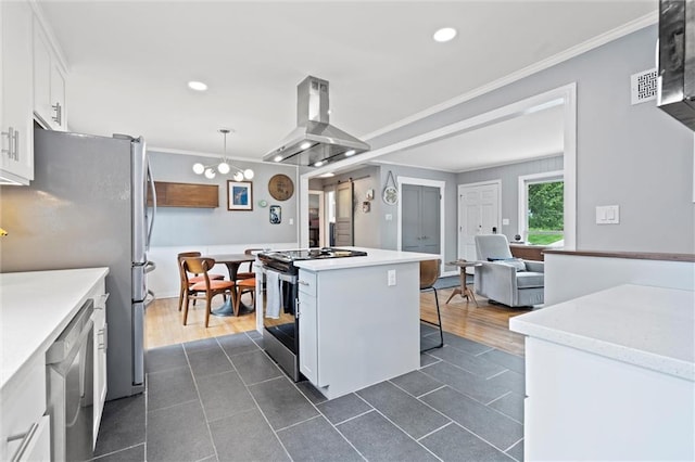 5001 W 70th St, Prairie Village, KS 66208 - kitchen featuring stainless steel appliances, island exhaust hood, dark tile patterned flooring, white cabinets, and recessed lighting