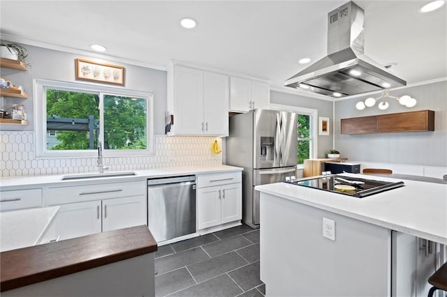5001 W 70th St, Prairie Village, KS 66208 - kitchen with appliances with stainless steel finishes, island exhaust hood, white cabinets, dark tile patterned flooring, and recessed lighting