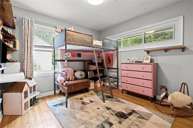5001 W 70th St, Prairie Village, KS 66208 - bedroom featuring multiple windows and wood finished floors