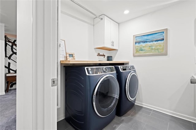 5001 W 70th St, Prairie Village, KS 66208 - laundry room featuring separate washer and dryer, cabinet space, and dark tile patterned flooring