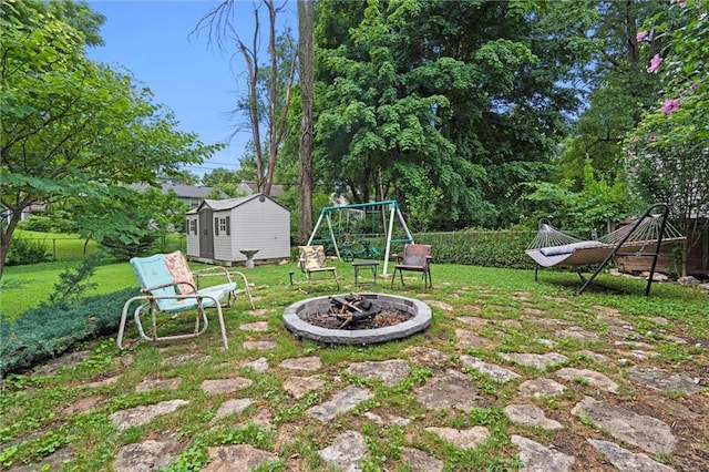 5001 W 70th St, Prairie Village, KS 66208 - view of yard with a fire pit, a shed, and a playground