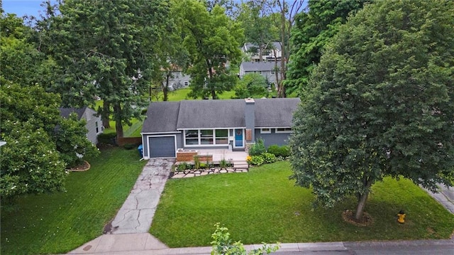 5001 W 70th St, Prairie Village, KS 66208 - view of front of property with a garage, driveway, a front yard, and a chimney