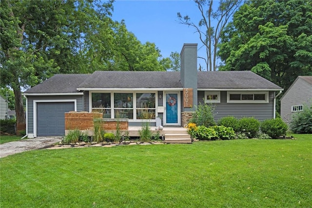 5001 W 70th St, Prairie Village, KS 66208 - view of front facade with an attached garage, a chimney, driveway, and a front yard