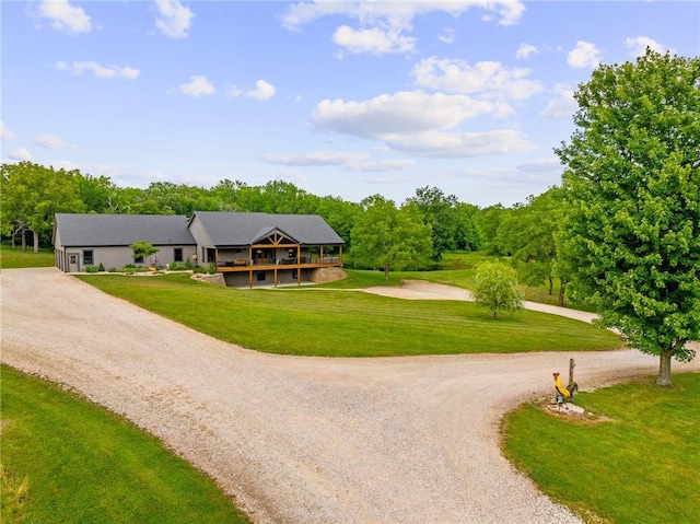 31788 W 223rd St, Spring Hill, KS 66083 - view of front of home with curved driveway, a front lawn, and a deck